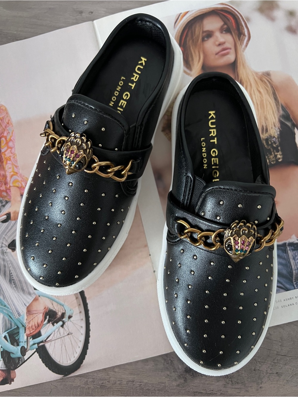 Kurt Geiger Girl’s Black Studded Slip-On Sneakers with Gold Chain Detail